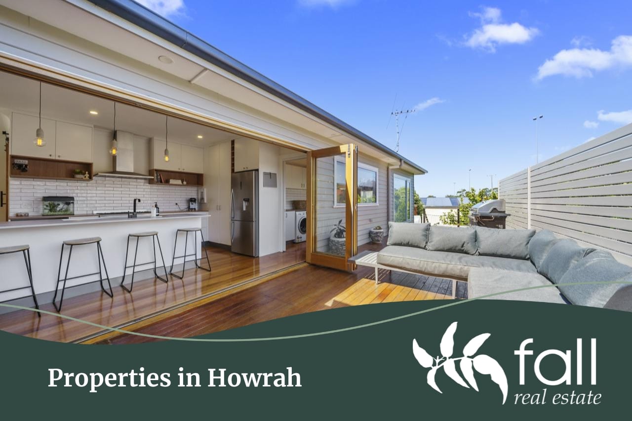 A white modern styled kitchen with a sleek deck